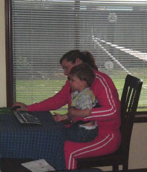 Garin helping Auntie Deb on the computer