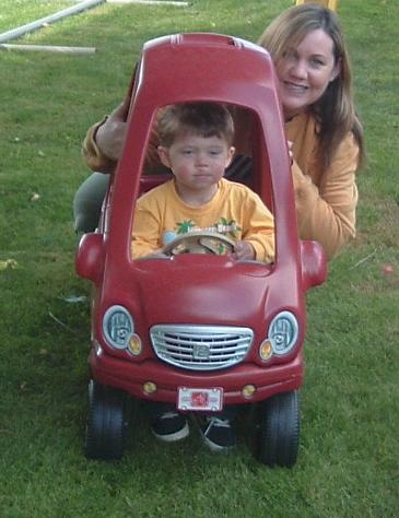 Auntie Deb pushes Mr. Garin in the backyard