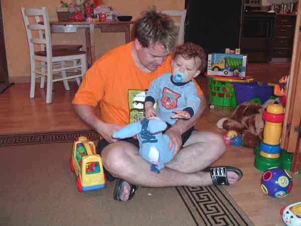 Daddy plays with Garin and his new toys